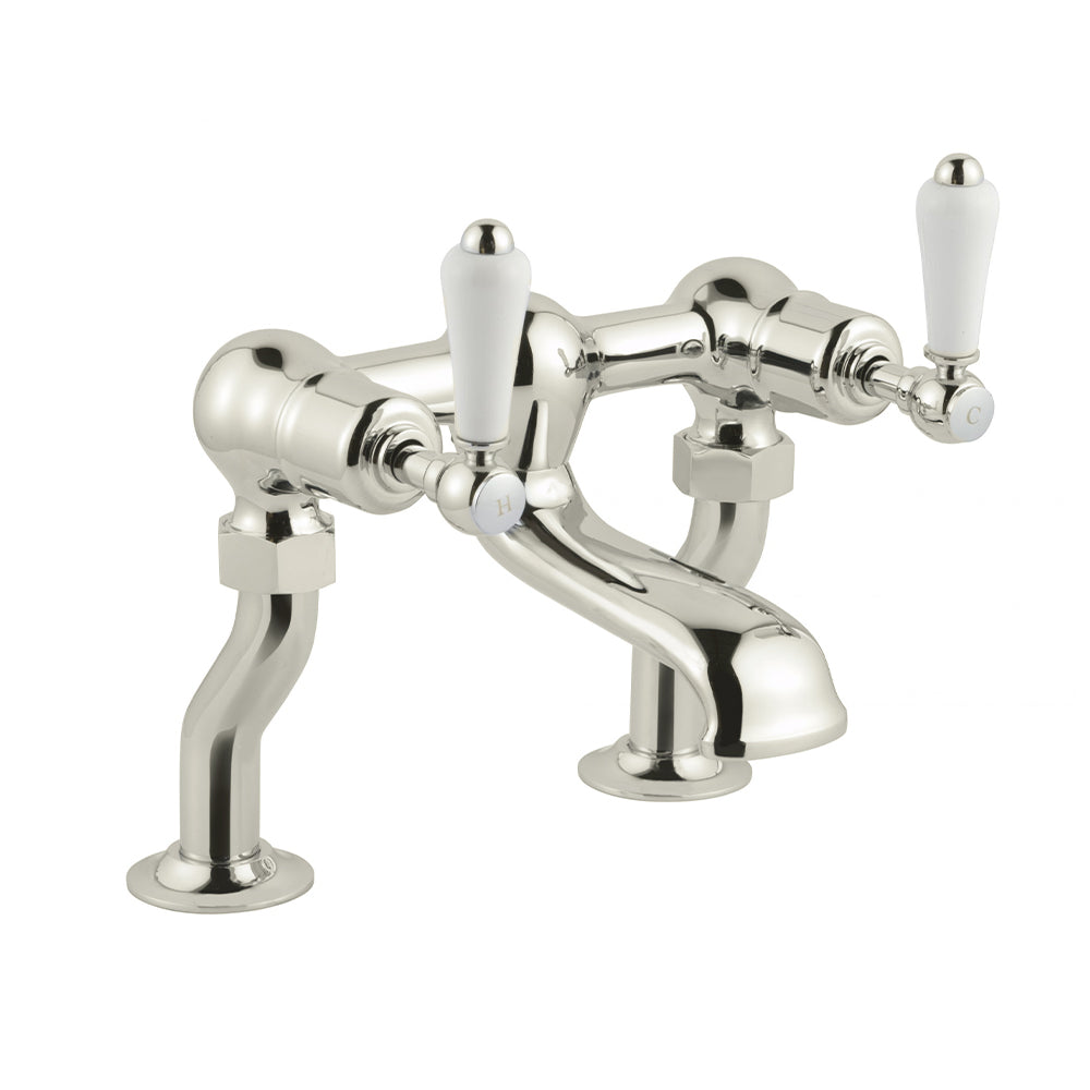Polished chrome bathroom sink mixer tap with white ceramic lever handle
