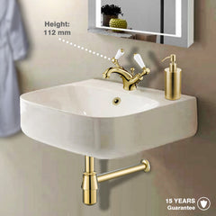 Gold basin mixer with matching gold bathroom accessories