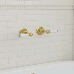 Brushed brass wall-mounted stop valve