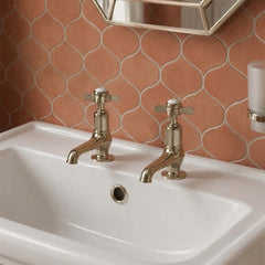Brushed nickel pillar basin taps with pinch handles 
