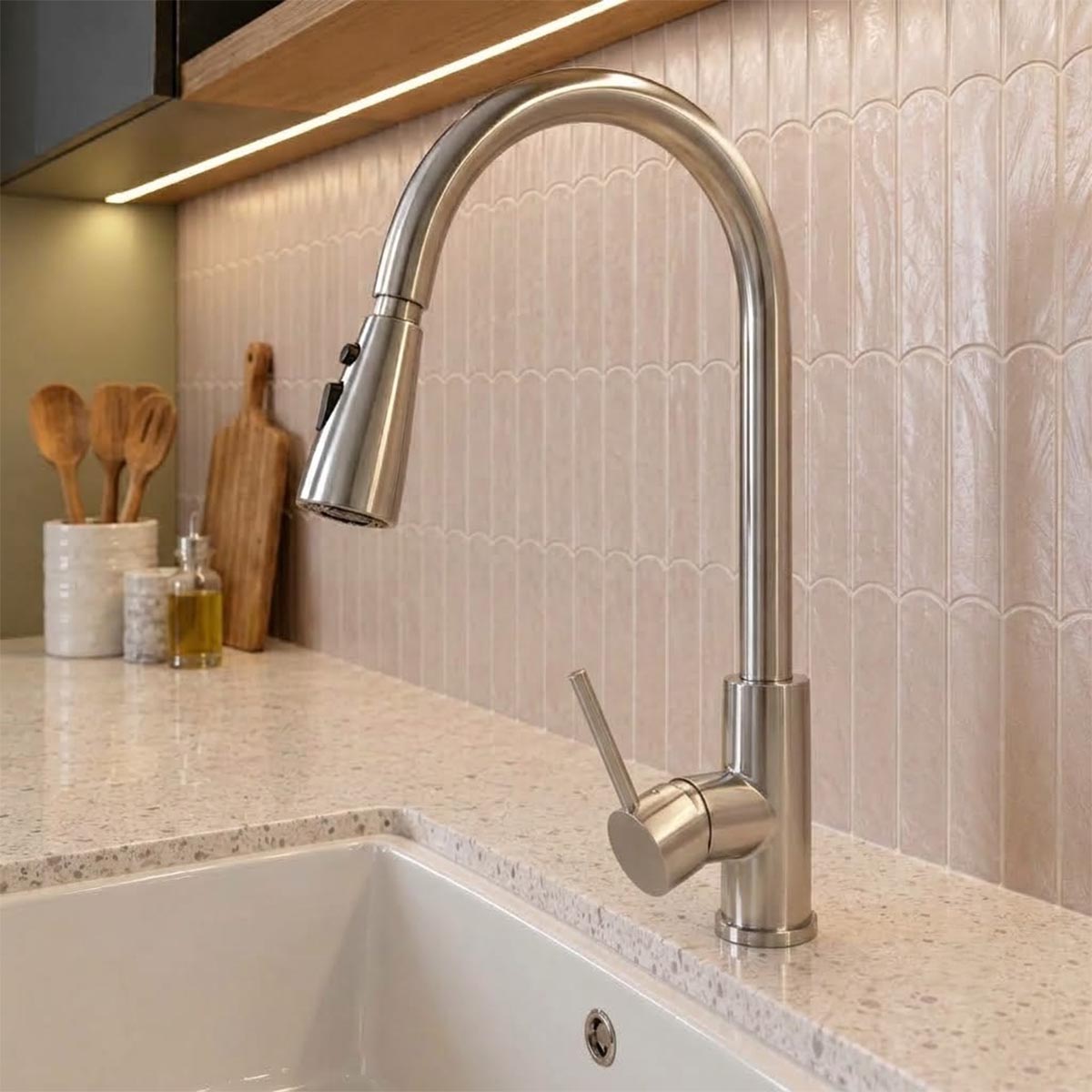 Brushed stainless steel kitchen tap with pull out spray