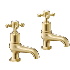 Deck-mounted brushed brass pillar bath tap