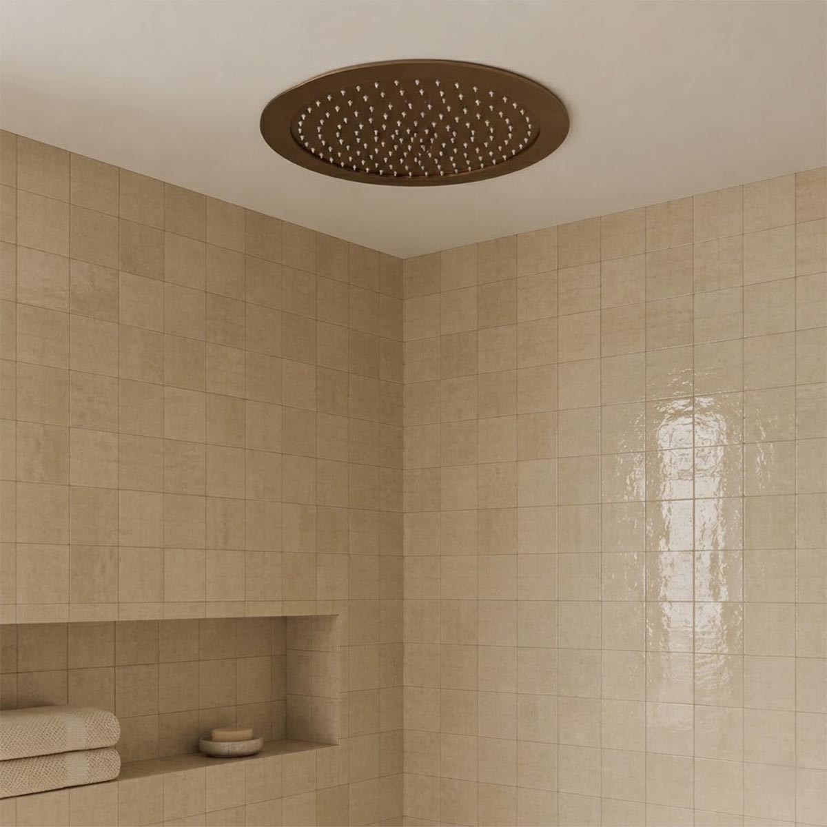 Round ceiling-mounted rain shower head in a warm bronze 