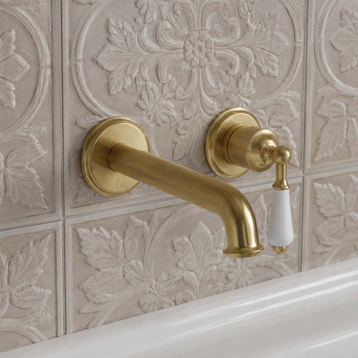 brushed brass single lever basin tap wall mounted 