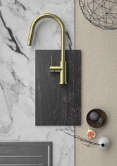 Brushed gold kitchen tap with pull out spray