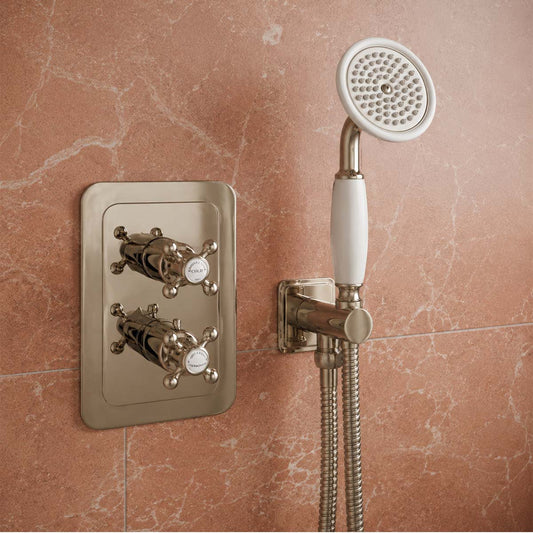 brushed nickel handheld showerhead with a white ceramic grip 1200
