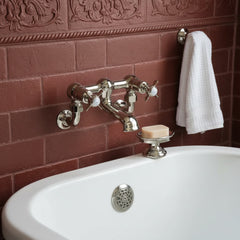 brushed nickel wall mounted bath tap with pinch style handles 