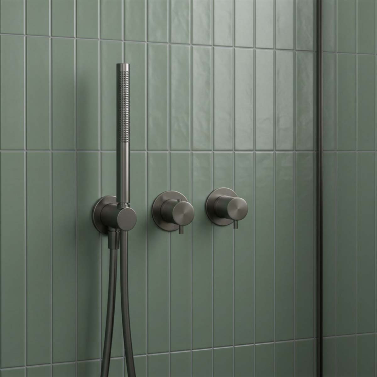 modern gunmetal shower fixture with a handheld showerhead and two control valves,