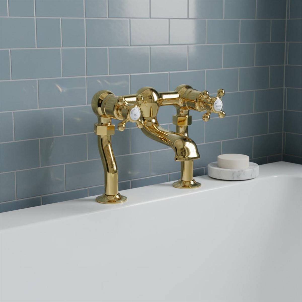 Traditional polished gold bridge bath tap with two white cross handles