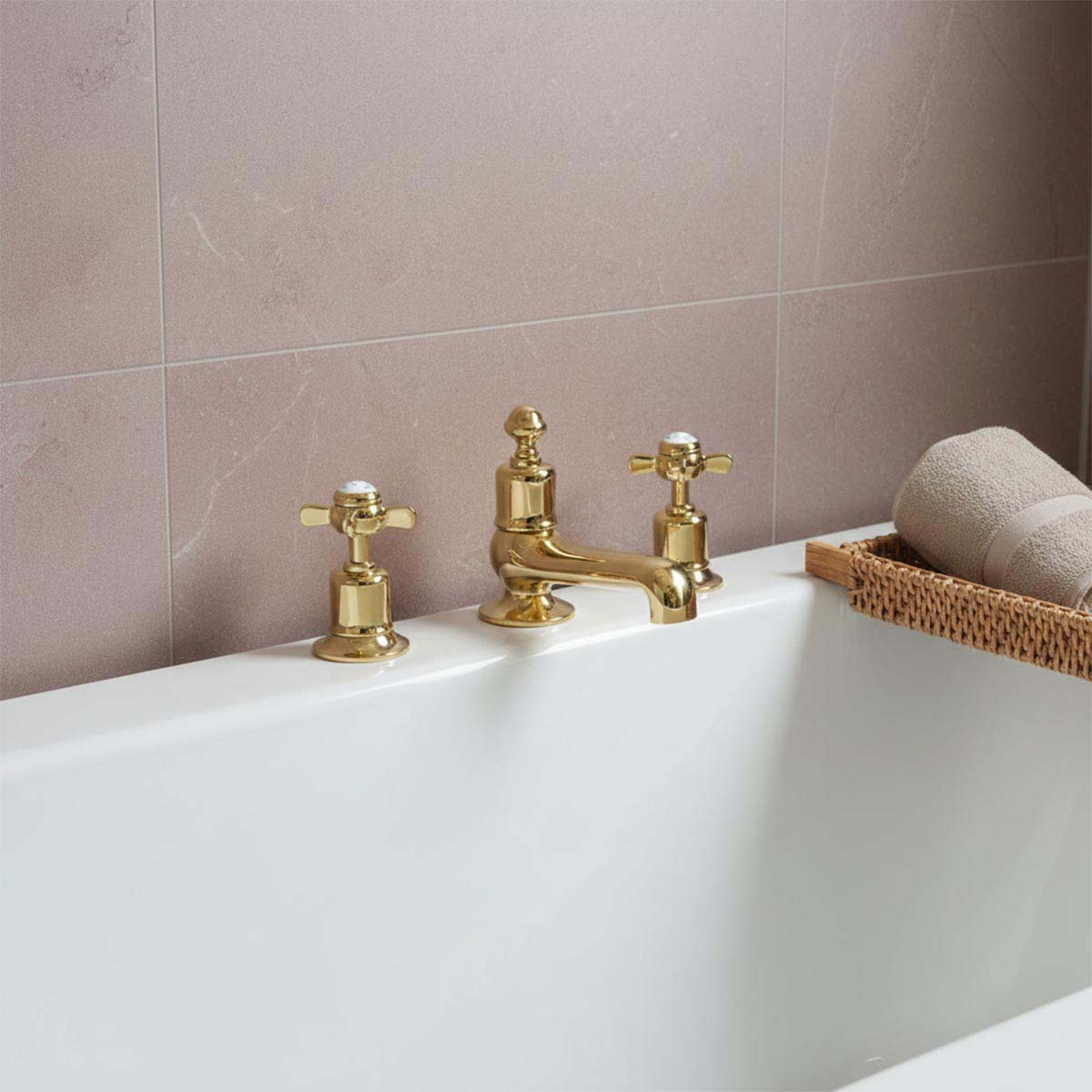 polished gold three-hole bath tap set with two cross handles and a central spout in Ireland