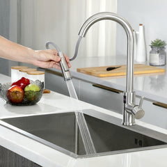 Steel kitchen tap with pull out spray