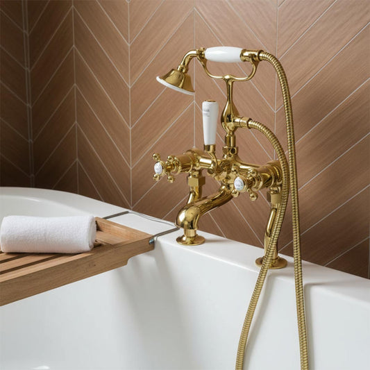 vintage-style brass bathtub tap set with a handheld shower hose, white ceramic handles, and a matching shower head 1200
