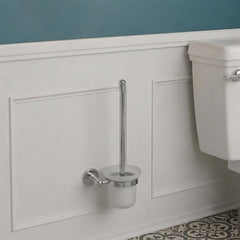 wall-mounted chrome toilet brush holder with a tall chrome handle and frosted white cup